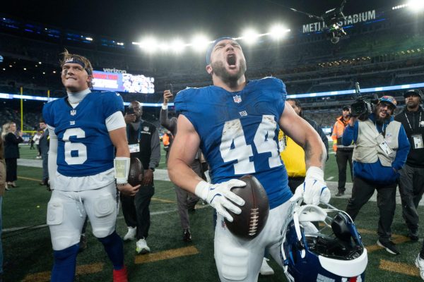 New York Giants running back Cam Skattebo (44) and New York Giants quarterback Jaxson Dart (6) walk off the field after winning a Thursday Night Football game between the New York Giants and the Philadelphia Eagles at MetLife Stadium in East Rutherford on Oct. 9, 2025.